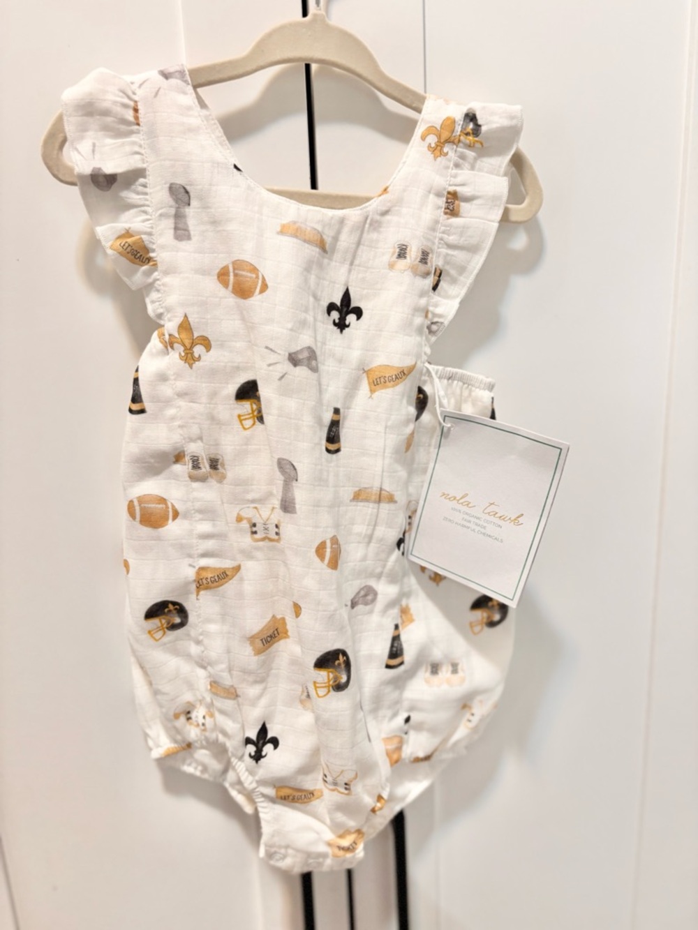 Nola Tawk White Baby Romper with Gold & Black Sports Print